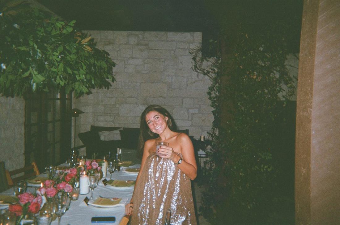 Keeli smiling at the head of the table