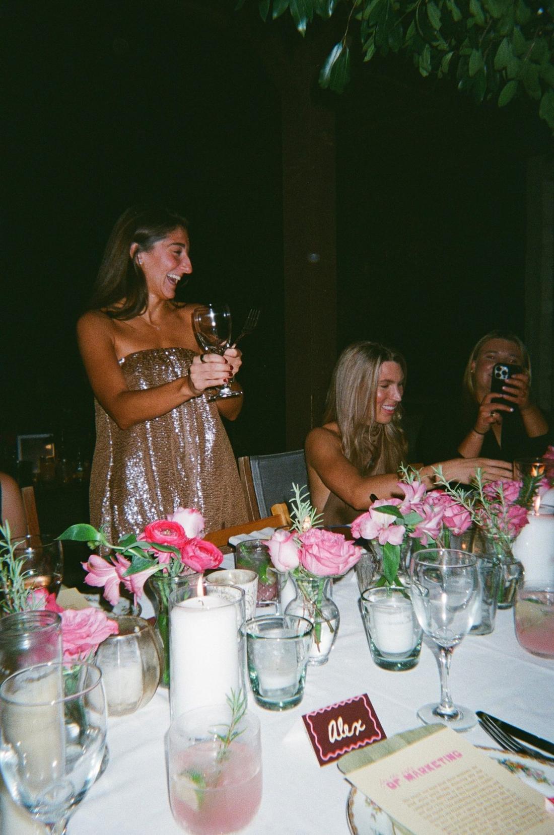 Keeli toasting the table at Le Dinner Party